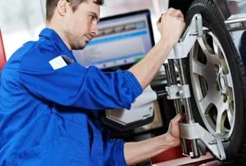 Wheel alignment service at Uptown Car Care in Houston Galleria area
